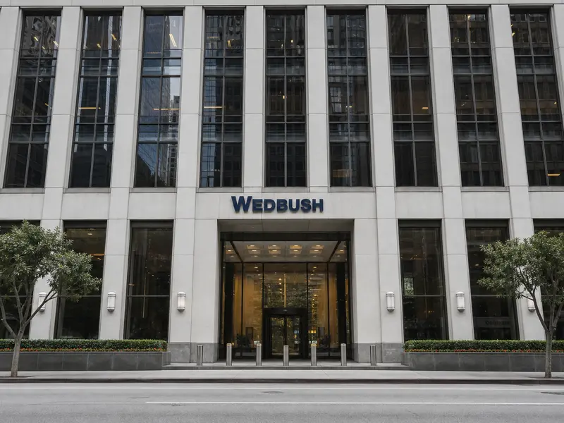The front-on exterior of the Wedbush Securities office tower in downtown Los Angeles seen from street level in flat daylight.