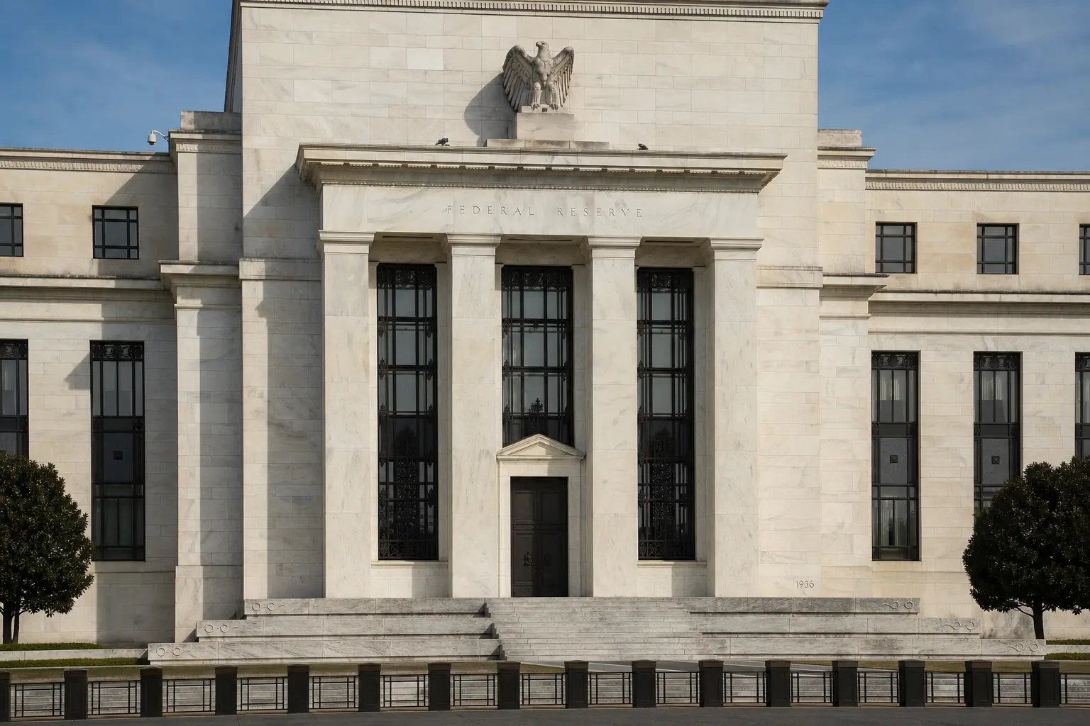 A straight front-on daytime view of the Marriner S. Eccles Federal Reserve building in Washington with its stone facade and Federal Reserve inscription above th